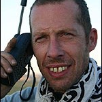 Peter Ash on the satellite phone in the Gobi desert